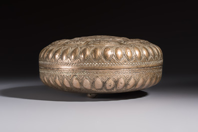 A Malay silver circular betel box and cover with floral design, 19th C.