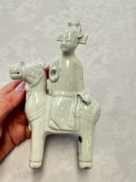 Two Chinese Dehua blanc-de-Chine Buddhist lions, three famille rose figures, and a white-glazed group, Kangxi and later