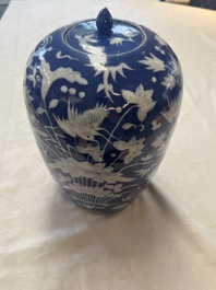 A pair of Chinese blue and white covered vases and two covered jars, Kangxi mark, 19th C