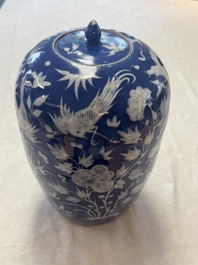 A pair of Chinese blue and white covered vases and two covered jars, Kangxi mark, 19th C