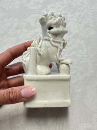 Two Chinese Dehua blanc-de-Chine Buddhist lions, three famille rose figures, and a white-glazed group, Kangxi and later