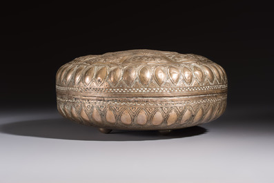 A Malay silver circular betel box and cover with floral design, 19th C.