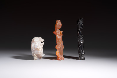 A group of ten Chinese hardstone and cherry amber carvings, 20th C.