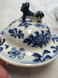 A pair of Chinese blue and white covered vases and two covered jars, Kangxi mark, 19th C