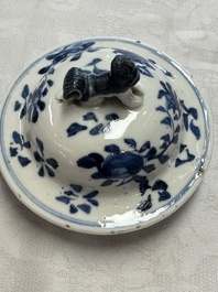 A pair of Chinese blue and white covered vases and two covered jars, Kangxi mark, 19th C