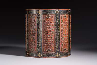 A Chinese gilt black-lacquered huanghuali brush pot with chilong design, Kangxi/Yongzheng
