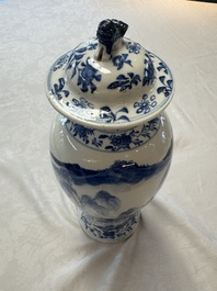 A pair of Chinese blue and white covered vases and two covered jars, Kangxi mark, 19th C