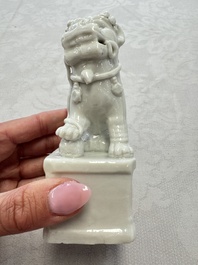 Two Chinese Dehua blanc-de-Chine Buddhist lions, three famille rose figures, and a white-glazed group, Kangxi and later