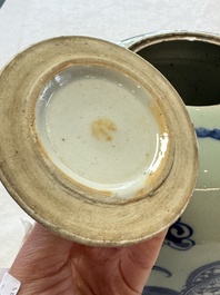 A pair of Chinese blue and white covered vases and two covered jars, Kangxi mark, 19th C