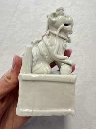 Two Chinese Dehua blanc-de-Chine Buddhist lions, three famille rose figures, and a white-glazed group, Kangxi and later