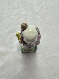 Two Chinese Dehua blanc-de-Chine Buddhist lions, three famille rose figures, and a white-glazed group, Kangxi and later