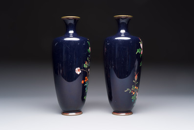 A pair of Japanese silver-wired cloisonn&eacute; enamel vases with birds among flowering branches, Meiji period, 19th C.