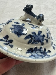 A pair of Chinese blue and white covered vases and two covered jars, Kangxi mark, 19th C