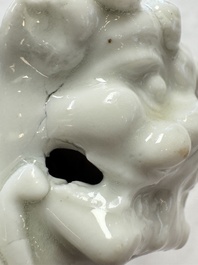 Two Chinese Dehua blanc-de-Chine Buddhist lions, three famille rose figures, and a white-glazed group, Kangxi and later