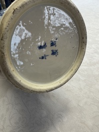 A pair of Chinese blue and white covered vases and two covered jars, Kangxi mark, 19th C