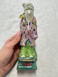 Two Chinese Dehua blanc-de-Chine Buddhist lions, three famille rose figures, and a white-glazed group, Kangxi and later