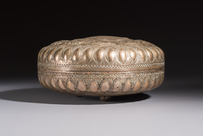 A Malay silver circular betel box and cover with floral design, 19th C.