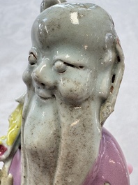 Two Chinese Dehua blanc-de-Chine Buddhist lions, three famille rose figures, and a white-glazed group, Kangxi and later