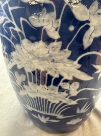A pair of Chinese blue and white covered vases and two covered jars, Kangxi mark, 19th C