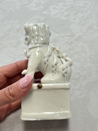 Two Chinese Dehua blanc-de-Chine Buddhist lions, three famille rose figures, and a white-glazed group, Kangxi and later