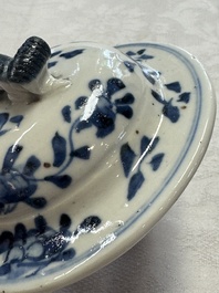 A pair of Chinese blue and white covered vases and two covered jars, Kangxi mark, 19th C