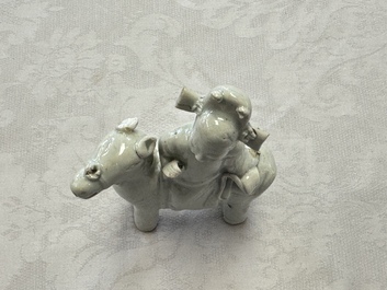 Two Chinese Dehua blanc-de-Chine Buddhist lions, three famille rose figures, and a white-glazed group, Kangxi and later