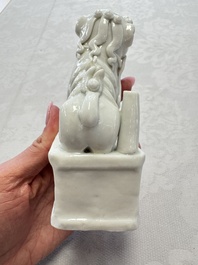 Two Chinese Dehua blanc-de-Chine Buddhist lions, three famille rose figures, and a white-glazed group, Kangxi and later