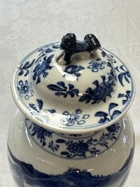 A pair of Chinese blue and white covered vases and two covered jars, Kangxi mark, 19th C