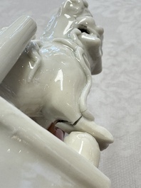 Two Chinese Dehua blanc-de-Chine Buddhist lions, three famille rose figures, and a white-glazed group, Kangxi and later