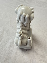 Two Chinese Dehua blanc-de-Chine Buddhist lions, three famille rose figures, and a white-glazed group, Kangxi and later