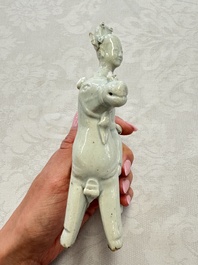 Two Chinese Dehua blanc-de-Chine Buddhist lions, three famille rose figures, and a white-glazed group, Kangxi and later