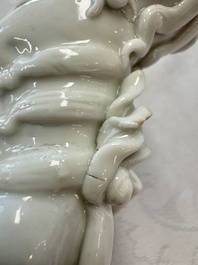 Two Chinese Dehua blanc-de-Chine Buddhist lions, three famille rose figures, and a white-glazed group, Kangxi and later