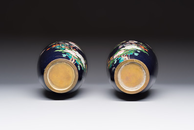 A pair of Japanese silver-wired cloisonn&eacute; enamel vases with birds among flowering branches, Meiji period, 19th C.