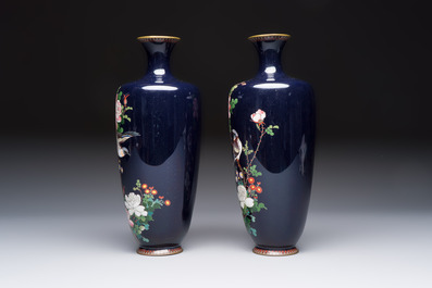 A pair of Japanese silver-wired cloisonn&eacute; enamel vases with birds among flowering branches, Meiji period, 19th C.