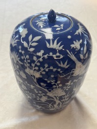 A pair of Chinese blue and white covered vases and two covered jars, Kangxi mark, 19th C