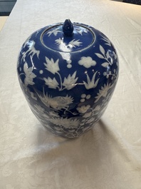 A pair of Chinese blue and white covered vases and two covered jars, Kangxi mark, 19th C