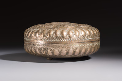 A Malay silver circular betel box and cover with floral design, 19th C.