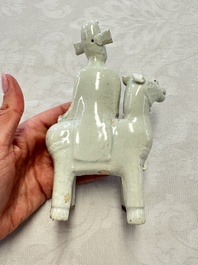 Two Chinese Dehua blanc-de-Chine Buddhist lions, three famille rose figures, and a white-glazed group, Kangxi and later