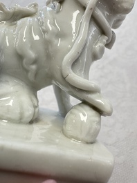 Two Chinese Dehua blanc-de-Chine Buddhist lions, three famille rose figures, and a white-glazed group, Kangxi and later