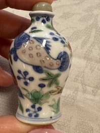 A Chinese iron-red 'Dragon' covered box, a blue and white '100 Boys' and a famille verte 'Fish' snuff bottle, Shunzhi mark, 19th C.