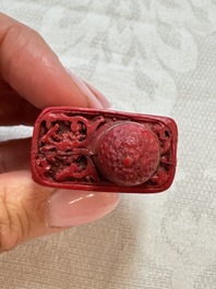 Nine Chinese cinnabar lacquer snuff bottles and a covered box, Qianlong marks, 19/20th C.
