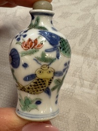 A Chinese iron-red 'Dragon' covered box, a blue and white '100 Boys' and a famille verte 'Fish' snuff bottle, Shunzhi mark, 19th C.