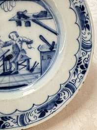 A pair of rare blue and white Dutch Delft 'Shoemaker' plates, 18th C.