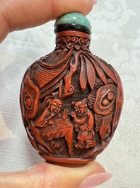 Nine Chinese cinnabar lacquer snuff bottles and a covered box, Qianlong marks, 19/20th C.