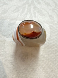 Five Chinese hardstone and glass snuff bottles, 20th C.