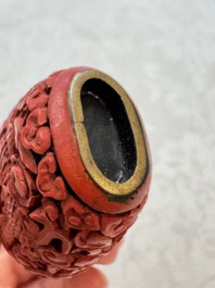 Nine Chinese cinnabar lacquer snuff bottles and a covered box, Qianlong marks, 19/20th C.
