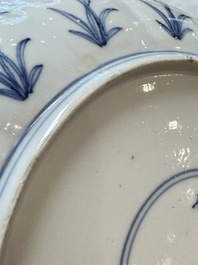 A pair of Chinese blue and white 'Hunting' plates, Chenghua marks, Kangxi