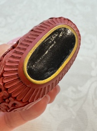 Nine Chinese cinnabar lacquer snuff bottles and a covered box, Qianlong marks, 19/20th C.