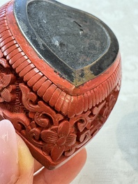 Nine Chinese cinnabar lacquer snuff bottles and a covered box, Qianlong marks, 19/20th C.