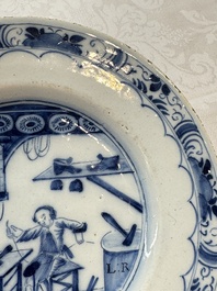 A pair of rare blue and white Dutch Delft 'Shoemaker' plates, 18th C.